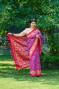 Dazzling Vibrant Purple Patola Silk With Contrast Magenta Border and Intricate Animal Motifs