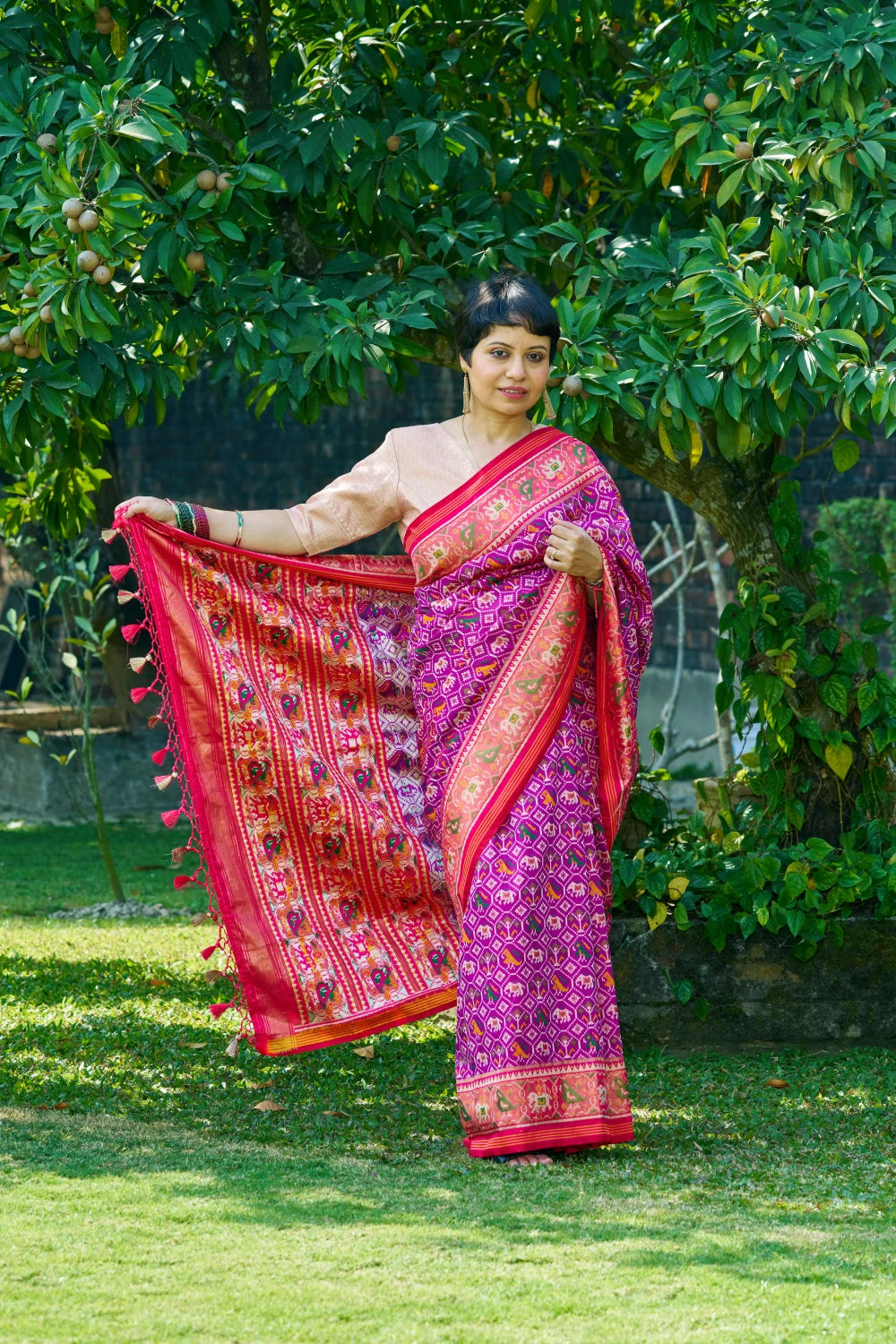 Dazzling Vibrant Purple Patola Silk With Contrast Magenta Border and Intricate Animal Motifs