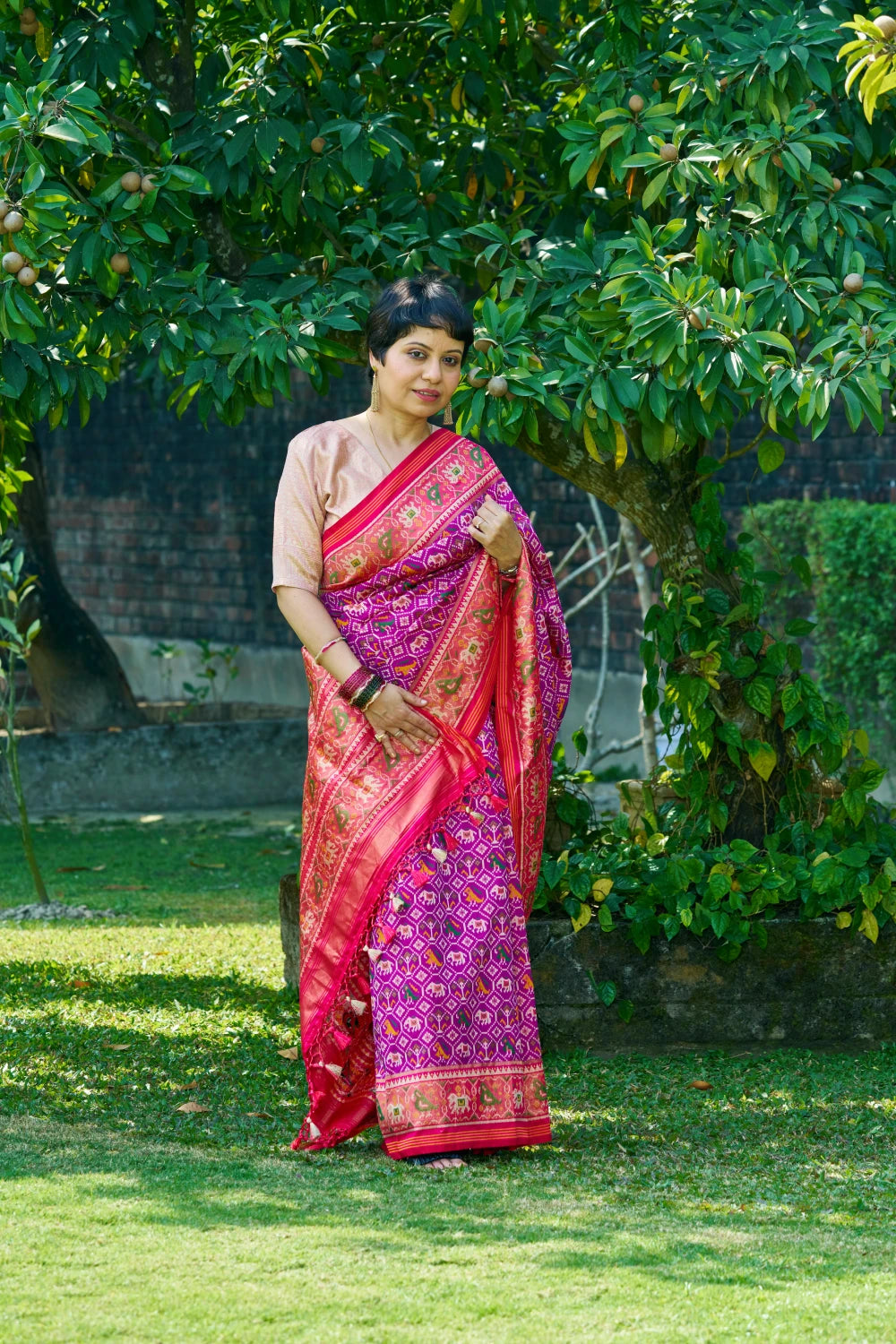 Dazzling Vibrant Purple Patola Silk With Contrast Magenta Border and Intricate Animal Motifs