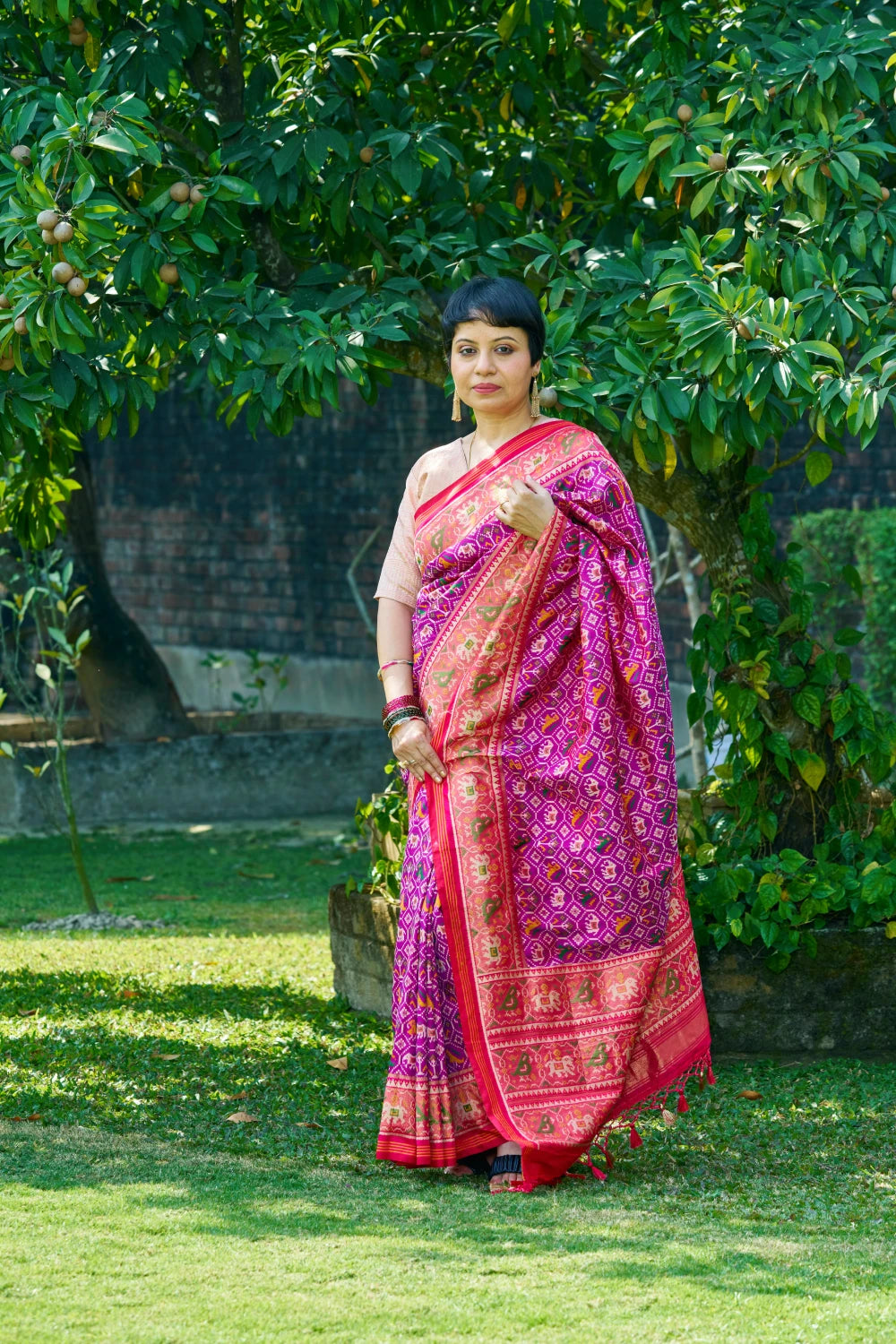 Dazzling Vibrant Purple Patola Silk With Contrast Magenta Border and Intricate Animal Motifs