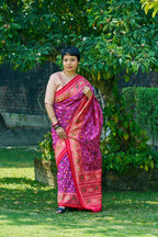 Dazzling Vibrant Purple Patola Silk With Contrast Magenta Border and Intricate Animal Motifs