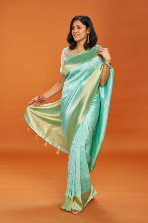 Aqua Green Muga Silk Saree with Shimmering Zari Border